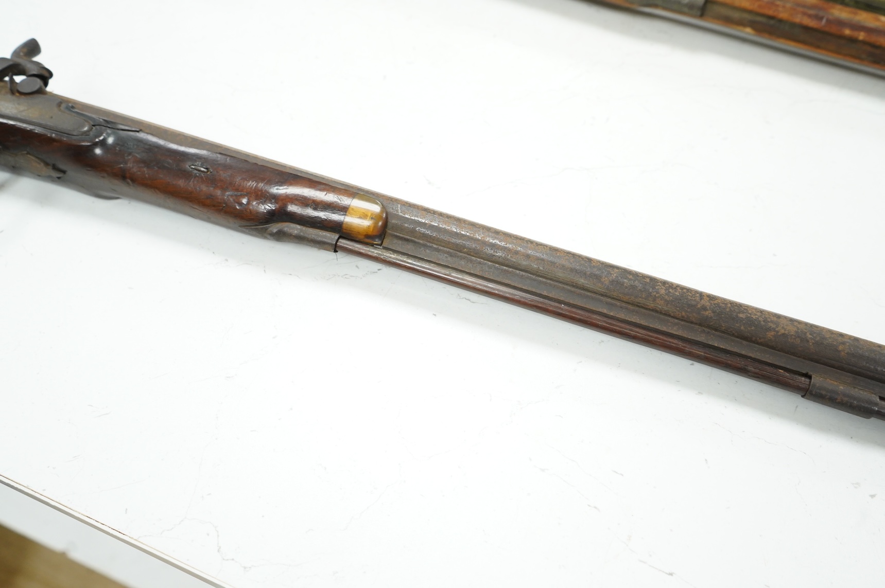 A 12 bore single barrel percussion sporting gun by J. Aston, the drum converted from flintlock, with engraved iron mounts, half stocked